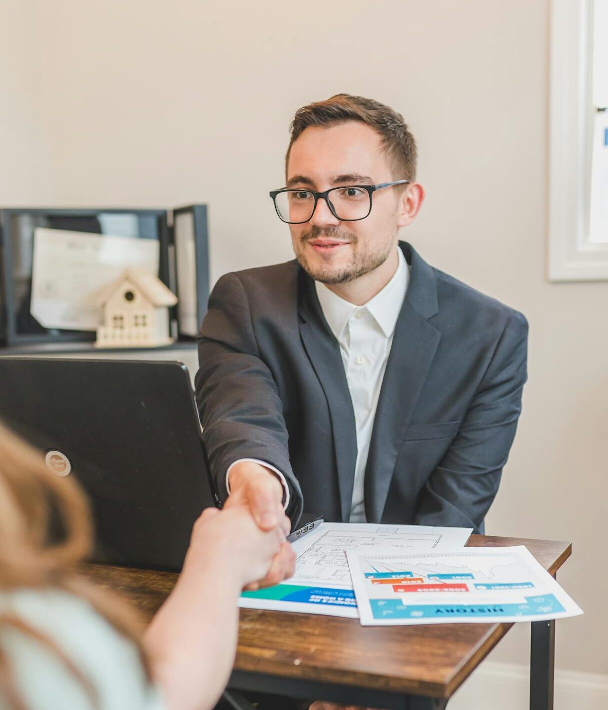 A Real Estate Agent Making a Deal with His Client
