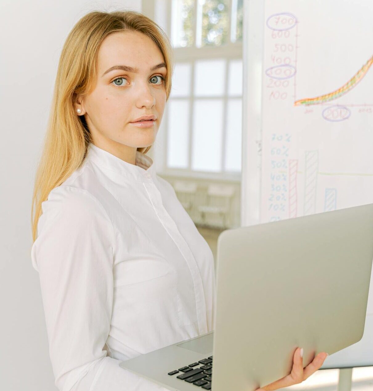 Female Professional holding a Laptop